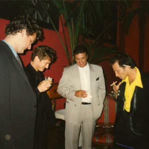 Sean Penn enjoys watching Simon Winthrop perform at the Hollywood world premiere of the movie 'The Game'